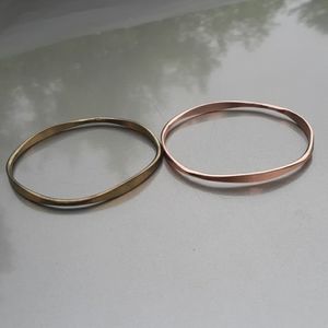 Two metal bangle bracelets